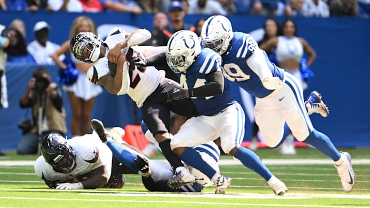 Houston Texans running back Joe Mixon (28) is hit hard by Indianapolis Colts linebacker Zaire Franklin (44) during the second half at Lucas Oil Stadium.