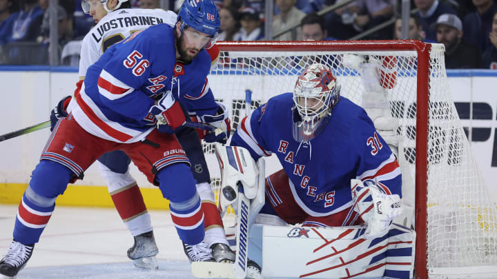 May 22, 2024; New York, New York, USA; New York Rangers defenseman Erik Gustafsson (56) and goaltender Igor Shesterkin (31) play the puck against Florida Panthers center Eetu Luostarinen (27) during the second period of game one of the Eastern Conference Final of the 2024 Stanley Cup Playoffs at Madison Square Garden. Mandatory Credit: Brad Penner-USA TODAY Sports