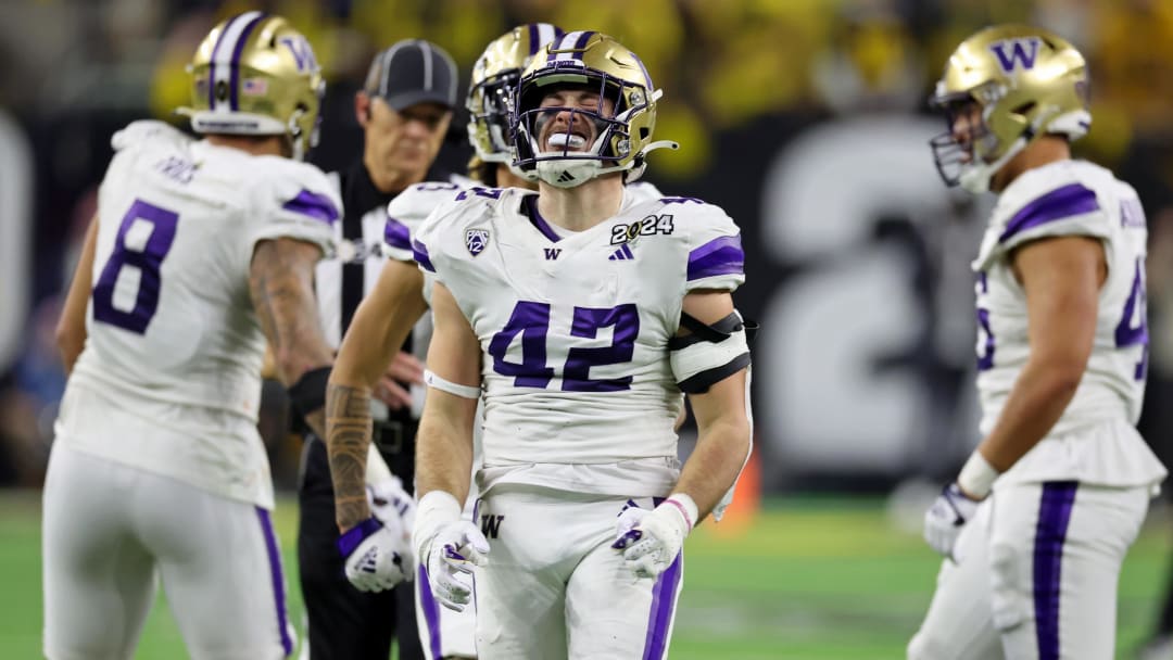 Jan 8, 2024; Houston, TX, USA; Washington Huskies linebacker Carson Bruener (42) reacts after a play against the Michigan Wolverines during the third quarter in the 2024 College Football Playoff national championship game at NRG Stadium. Mandatory Credit: Thomas Shea-USA TODAY Sports