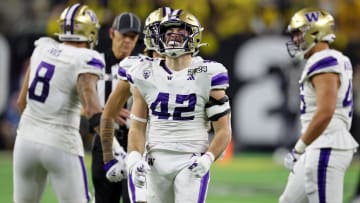 Jan 8, 2024; Houston, TX, USA; Washington Huskies linebacker Carson Bruener (42) reacts after a play against the Michigan Wolverines during the third quarter in the 2024 College Football Playoff national championship game at NRG Stadium. Mandatory Credit: Thomas Shea-USA TODAY Sports