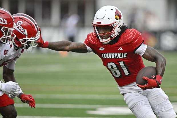 Louisville Cardinals wide receiver Cataurus Hicks (81) runs the ball