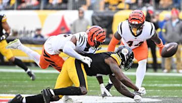 Nov 16, 2025; Pittsburgh, Pennsylvania, USA; Cincinnati Bengals cornerback Dax Hill (23) breaks up a pass intended for Pittsburgh Steelers wide receiver DK Metcalf (4) during the first half at Acrisure Stadium. Mandatory Credit: Barry Reeger-Imagn Images