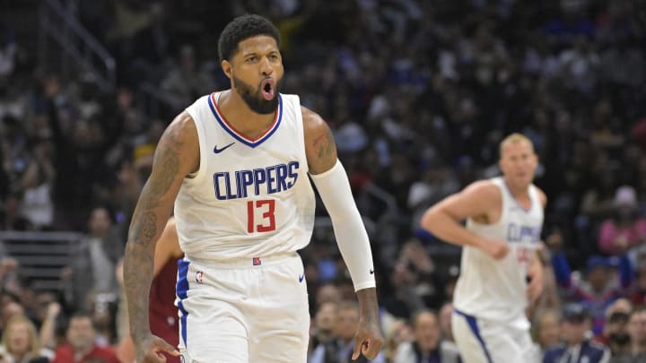 Apr 7, 2024; Los Angeles, California, USA; Los Angeles Clippers forward Paul George (13) celebrates after a three point basket in the fourth quarter against the Cleveland Cavaliers at Crypto.com Arena. Mandatory Credit: Jayne Kamin-Oncea-USA TODAY Sports