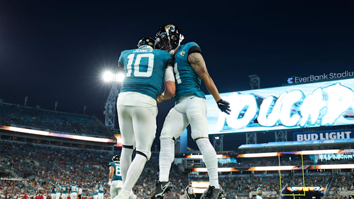 Aug 17, 2024; Jacksonville, Florida, USA; Jacksonville Jaguars quarterback Mac Jones (10) congratulates wide receiver Parker Washington (11) after scoring a touchdown against the Tampa Bay Buccaneers in the second quarter during a preseason game at EverBank Stadium.