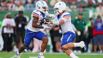 Boise State quarterback Maddux Madsen hands off to Malik Sherrod.