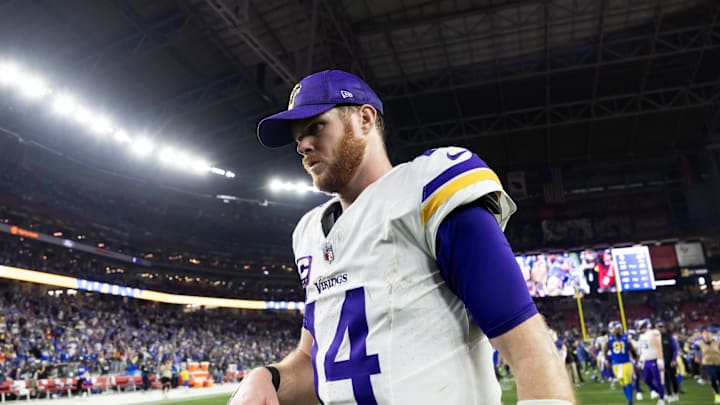 Jan 13, 2025; Glendale, AZ, USA; Minnesota Vikings quarterback Sam Darnold (14) reacts as he walks off the field after losing to the Los Angeles Rams during an NFC wild card game at State Farm Stadium. Mandatory Credit: Mark J. Rebilas-Imagn Images