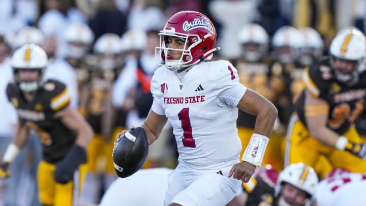 Oct 7, 2023; Laramie, Wyoming, USA; Fresno State Bulldogs quarterback Mikey Keene (1) runs with the ball against the Wyoming Cowboys during the first quarter at Jonah Field at War Memorial Stadium. Mandatory Credit: Troy Babbitt-USA TODAY Sports