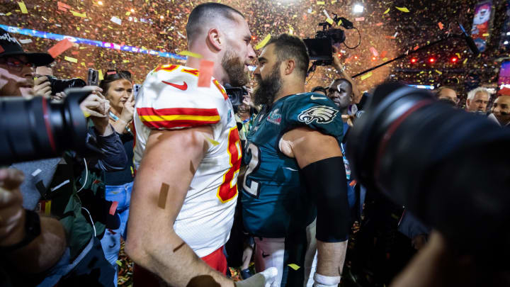 Feb 12, 2023; Glendale, Arizona, US; Kansas City Chiefs tight end Travis Kelce (87) talks with his brother Philadelphia Eagles center Jason Kelce (62) after Super Bowl LVII at State Farm Stadium. Mandatory Credit: Mark J. Rebilas-USA TODAY Sports