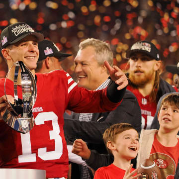 Jan 28, 2024; Santa Clara, California, USA; San Francisco 49ers quarterback Brock Purdy (13) holds the George Halas Trophy while after winning the NFC Championship football game against the Detroit Lions at Levi's Stadium. Mandatory Credit: Kelley L Cox-USA TODAY Sports