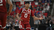 Mar 21, 2025; Raleigh, NC, USA;  Oklahoma Sooners guard Jeremiah Fears (0) reacts after scoring against Connecticut Huskies during the second half at Lenovo Center. Mandatory Credit: Zachary Taft-Imagn Images