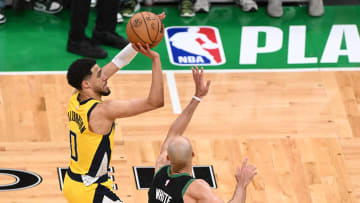 May 23, 2024; Boston, Massachusetts, USA; Indiana Pacers guard Tyrese Haliburton (0) shoots the ball against Boston Celtics guard Derrick White (9) in the first half during game two of the eastern conference finals for the 2024 NBA playoffs at TD Garden. Mandatory Credit: Brian Fluharty-USA TODAY Sports