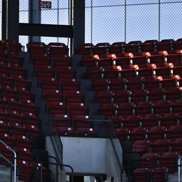 May 16, 2023; St. Louis, Missouri, USA;  A fan runs through an empty sections of seats before a game between the St. Louis Cardinals and the Milwaukee Brewers at Busch Stadium. Mandatory Credit: Jeff Curry-USA TODAY Sports