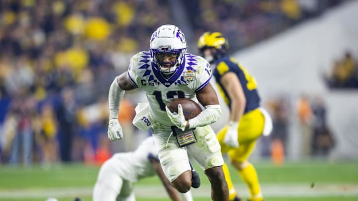 Dec 31, 2022; Glendale, Arizona, USA; TCU Horned Frogs linebacker Dee Winters (13) runs to score a touchdown on a pick six in the third quarter against the Michigan Wolverines in the 2022 Fiesta Bowl at State Farm Stadium. Mandatory Credit: Mark J. Rebilas-Imagn Images Dec 31, 2022; Glendale, Arizona, USA; TCU Horned Frogs linebacker Dee Winters (13) runs to score a touchdown on a pick six in the third quarter against the Michigan Wolverines in the 2022 Fiesta Bowl at State Farm Stadium. Mandatory Credit: Mark J. Rebilas-Imagn Images
