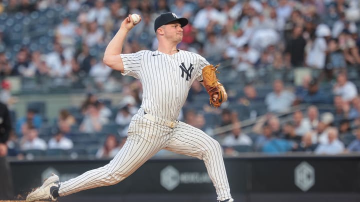 May 21, 2024; Bronx, New York, USA; New York Yankees starting pitcher Clarke Schmidt (36) delivers a pitch during the third inning against the Seattle Mariners at Yankee Stadium. Mandatory Credit: Vincent Carchietta-USA TODAY Sports