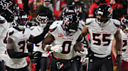 Dec 7, 2025; Kansas City, Missouri, USA; Houston Texans linebacker Azeez Al-Shaair (0) celebrates with his teammates after an interception during the fourth quarter against the Kansas City Chiefs at GEHA Field at Arrowhead Stadium. Mandatory Credit: Amy Kontras-Imagn Images