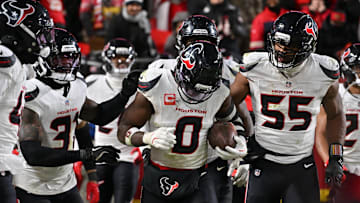 Dec 7, 2025; Kansas City, Missouri, USA; Houston Texans linebacker Azeez Al-Shaair (0) celebrates with his teammates after an interception during the fourth quarter against the Kansas City Chiefs at GEHA Field at Arrowhead Stadium. Mandatory Credit: Amy Kontras-Imagn Images