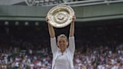 Simona Halep poses with the 2019 Wimbledon trophy after beating Serena Williams.