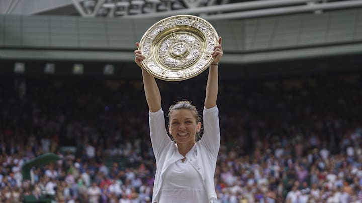 Simona Halep poses with the 2019 Wimbledon trophy after beating Serena Williams. Simona Halep poses with the 2019 Wimbledon trophy after beating Serena Williams.