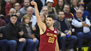 Jan 30, 2025; Cleveland, Ohio, USA; Cleveland Cavaliers forward Georges Niang (20) follows through on a three-point basket in the third quarter against the Atlanta Hawks at Rocket Mortgage FieldHouse. Mandatory Credit: David Richard-Imagn Images