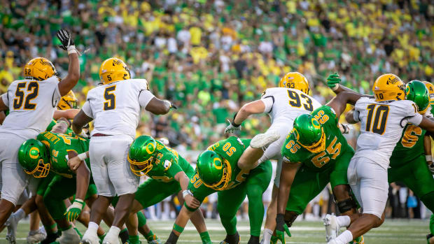 Oregon linemen hold the line during a point after kick as the Oregon Ducks host the Idaho Vandals Saturday, Aug. 31, 2024 at 