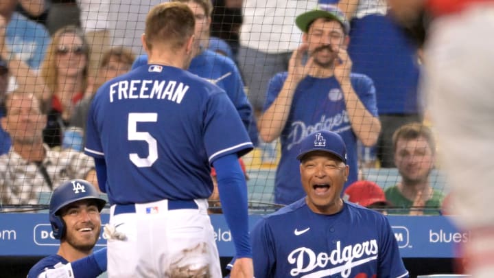 Los Angeles Dodgers first baseman Freddie Freeman is welcomed back to the dugout by his teammates in the Battle for L.A. vs. the Angels.