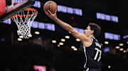 Dec 6, 2025; Brooklyn, New York, USA; Brooklyn Nets guard Ben Saraf (77) goes to the basket during the second half against the New Orleans Pelicans at Barclays Center. Mandatory Credit: Vincent Carchietta-Imagn Images