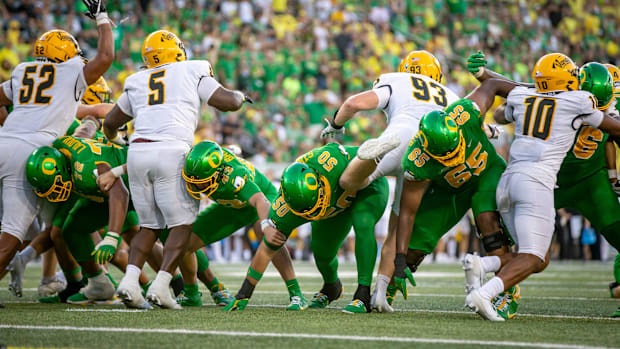 Oregon linemen hold the line during a point after kick as the Oregon Ducks host the Idaho Vandals Saturday, Aug. 31, 2024 at 