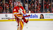 Apr 15, 2025; Calgary, Alberta, CAN; Calgary Flames goaltender Dustin Wolf (32) celebrates win after defeating Vegas Golden Knights at Scotiabank Saddledome. Mandatory Credit: Sergei Belski-Imagn Images
