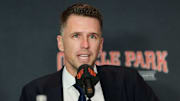 Dec 12, 2024; San Francisco, CA, USA; San Francisco Giants president of baseball operations Buster Posey speaks during the introductory press conference for shortstop Willy Adames (not pictured) at Oracle Park.