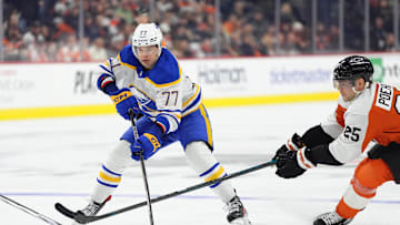 Mar 29, 2025; Philadelphia, Pennsylvania, USA; Buffalo Sabres right wing JJ Peterka (77) controls the puck against Philadelphia Flyers center Ryan Poehling (25) in the third period at Wells Fargo Center. Mandatory Credit: Kyle Ross-Imagn Images