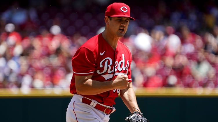 Cincinnati Reds starting pitcher Tyler Mahle (30) reacts after striking out a batter.