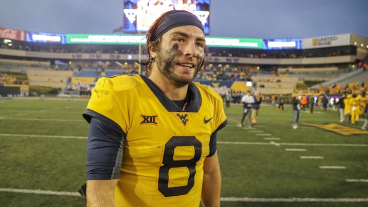 Sep 23, 2023; Morgantown, West Virginia, USA; West Virginia Mountaineers quarterback Nicco Marchiol (8) celebrates after defeating the Texas Tech Red Raiders at Mountaineer Field at Milan Puskar Stadium. Mandatory Credit: Ben Queen-Imagn Images