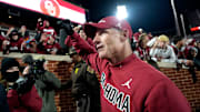 Oklahoma coach Brent Venables pumps his fist as he leaves the field following the Sooners' win over LSU.