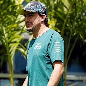 May 5, 2024; Miami Gardens, Florida, USA; Aston Matrin driver Fernando Alonso (14) walks into the F1 Village before the F1 Miami Grand Prix at Miami International Autodrome. Mandatory Credit: Peter Casey-USA TODAY Sports