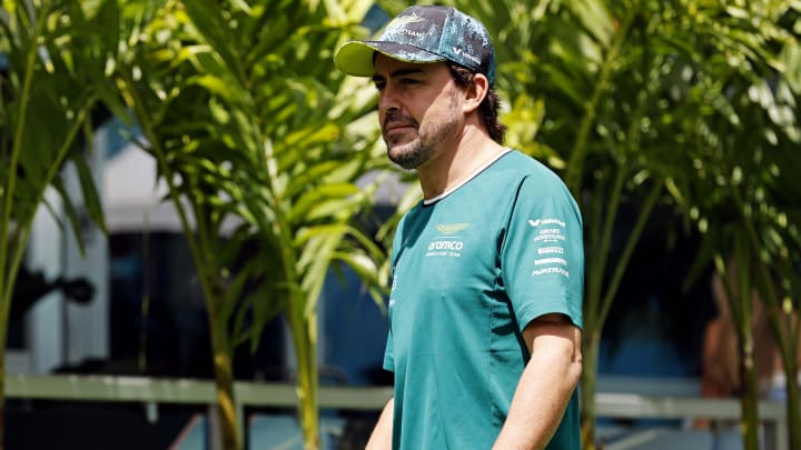 May 5, 2024; Miami Gardens, Florida, USA; Aston Matrin driver Fernando Alonso (14) walks into the F1 Village before the F1 Miami Grand Prix at Miami International Autodrome. Mandatory Credit: Peter Casey-USA TODAY Sports