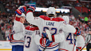 Mar 30, 2025; Sunrise, Florida, USA; Montreal Canadiens right wing Patrik Laine (92) celebrates with teammates after scoring against the Florida Panthers during the first period at Amerant Bank Arena. Mandatory Credit: Sam Navarro-Imagn Images
