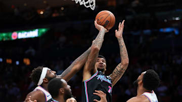 Nov 17, 2025; Miami, Florida, USA; Miami Heat center Kel'el Ware (7) shoots the basketball against New York Knicks center Karl-Anthony Towns (32) during the first quarter at Kaseya Center. Mandatory Credit: Sam Navarro-Imagn Images