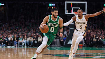 Jan 12, 2025; Boston, Massachusetts, USA; Boston Celtics forward Jayson Tatum (0) drives to the basket during the first half against the New Orleans Pelicans at TD Garden. Mandatory Credit: Paul Rutherford-Imagn Images