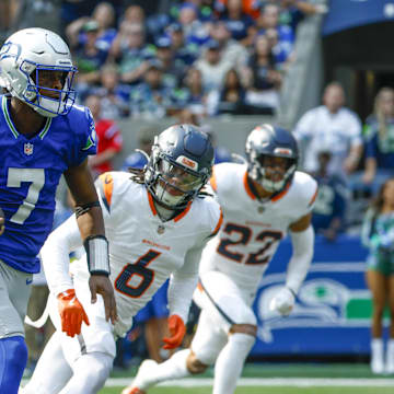 Sep 8, 2024; Seattle, Washington, USA; Seattle Seahawks quarterback Geno Smith (7) rushes for a touchdown against the Denver Broncos during the second quarter at Lumen Field. Mandatory Credit: Joe Nicholson-Imagn Images