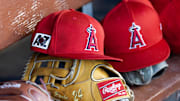 Feb 28, 2025; Phoenix, Arizona, USA; Detailed view of the Los Angeles Angels logo on a hat in the dugout during a spring training game at Camelback Ranch-Glendale. Mandatory Credit: Mark J. Rebilas-Imagn Images