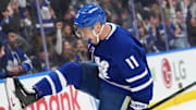 Dec 15, 2024; Toronto, Ontario, CAN; Toronto Maple Leafs center Max Domi (11) scores a goal and celebrates against the against the Buffalo Sabres during the first period at Scotiabank Arena. Mandatory Credit: Nick Turchiaro-Imagn Images