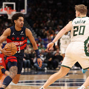 Feb 21, 2025; Washington, District of Columbia, USA; Washington Wizards guard Jordan Poole (13) drives to the basket as Milwaukee Bucks guard AJ Green (20) defends in the second half at Capital One Arena. Mandatory Credit: Geoff Burke-Imagn Images