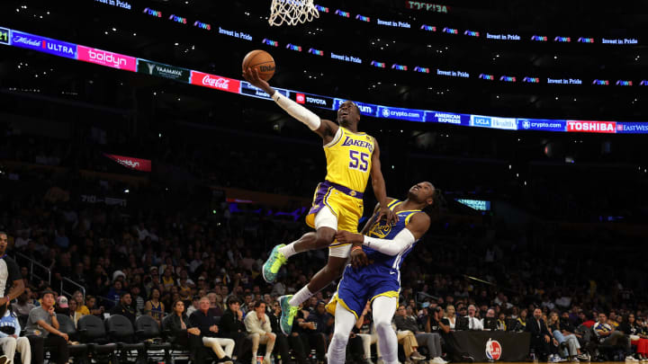 Oct 13, 2023; Los Angeles, California, USA; Los Angeles Lakers guard D'Moi Hodge (55) goes to the basket against Golden State Warriors forward Jonathan Kuminga (00) during the fourth quarter at Crypto.com Arena. Mandatory Credit: Kiyoshi Mio-USA TODAY Sports