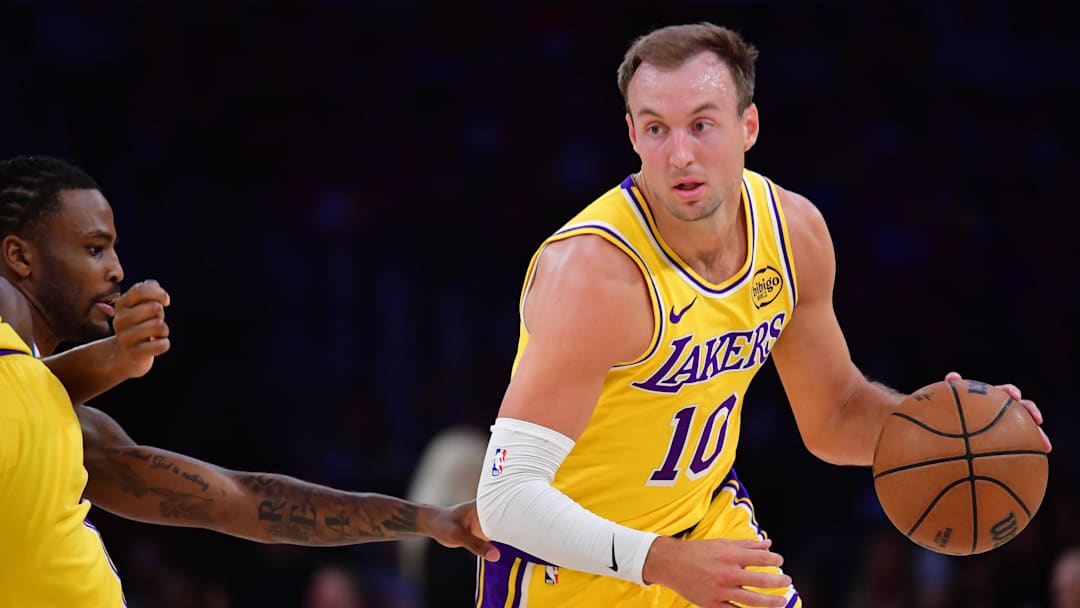 April 7, 2026; Los Angeles, California, USA; Los Angeles Lakers guard Luke Kennard (10) moves the ball against the Oklahoma City Thunder during the first half at Crypto.com Arena. Mandatory Credit: Gary A. Vasquez-Imagn Images