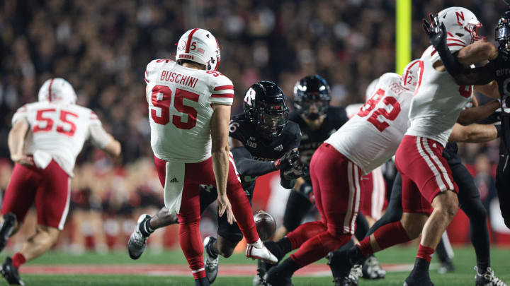 Oct 7, 2022; Piscataway, New Jersey, USA; Rutgers Scarlet Knights defensive back Max Melton (16) blocks a punt by Nebraska Cornhuskers punter Brian Buschini (95) during the first half at SHI Stadium.