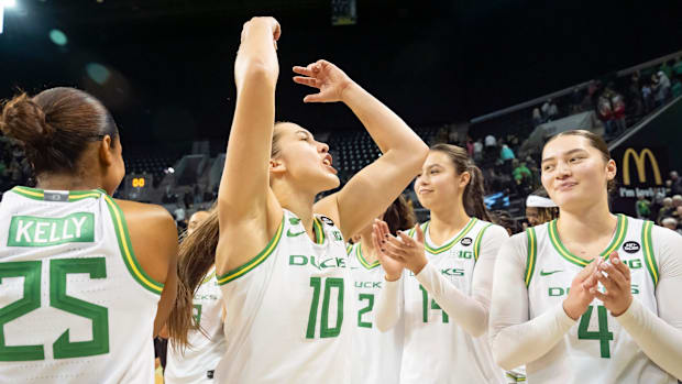 Oregon guard Peyton Scott riles up the crowd after the Ducks’ win as the Oregon Ducks host the Indiana Hoosiers Friday, Jan. 