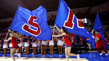 The SMU Mustangs cheerleaders run out on to the floor for their game against the Memphis Tigers at the Moody Coliseum on Tuesday, Feb. 25, 2020.

W 20054a