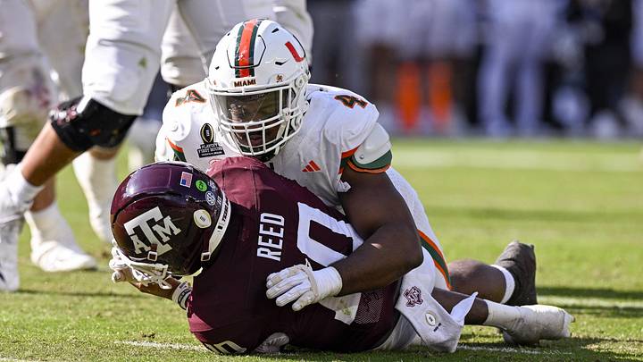 Dec 20, 2025; College Station, TX, USA; Miami Hurricanes defensive lineman Rueben Bain Jr. (4) sacks Texas A&M Aggies quarterback Marcel Reed (10) during the game between the Aggies and the Hurricanes at Kyle Field. Mandatory Credit: Jerome Miron-Imagn Images