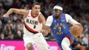 Feb 23, 2024; Portland, Oregon, USA; Denver Nuggets point guard Reggie Jackson (7) drives to the basket against Portland Trail Blazers forward Kris Murray (8) during the second half at Moda Center. Mandatory Credit: Soobum Im-USA TODAY Sports