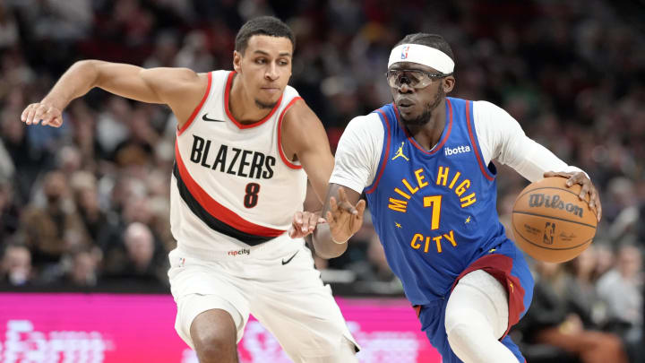 Feb 23, 2024; Portland, Oregon, USA; Denver Nuggets point guard Reggie Jackson (7) drives to the basket against Portland Trail Blazers forward Kris Murray (8) during the second half at Moda Center. Mandatory Credit: Soobum Im-USA TODAY Sports